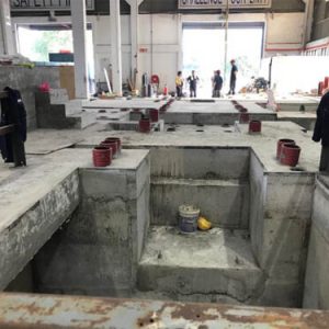 longitudinal machine pit construction